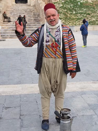 Vender of famous drinks in Damascus street with the traditional customs.